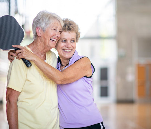 ladies playing pickleball